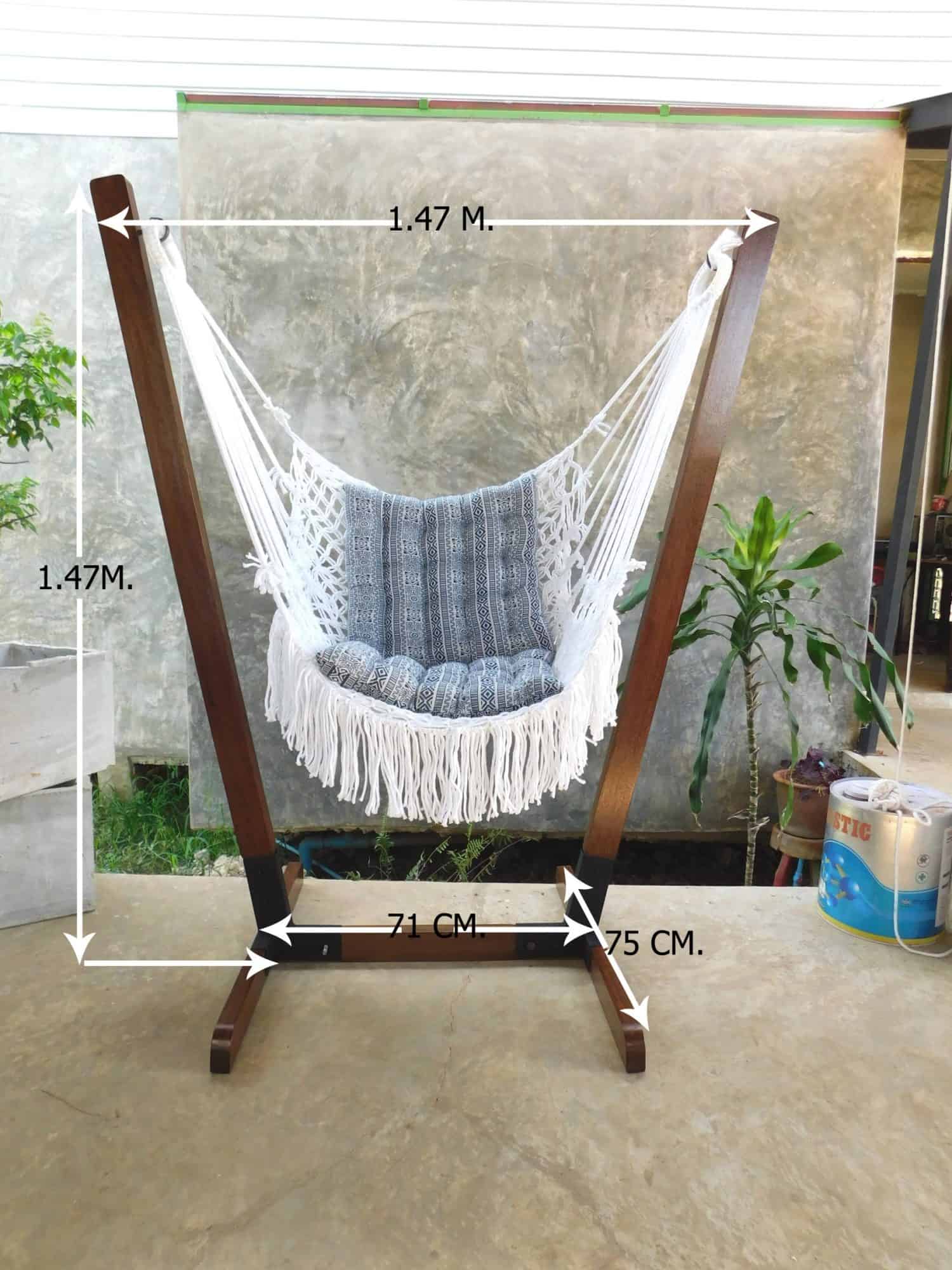 Indoor/Outdoor hanging chair stand dimensions with a white cotton macrame chair. Stand height and width are 1.47 meters. Detailed dimensions provided for wooden hammock chair stand.