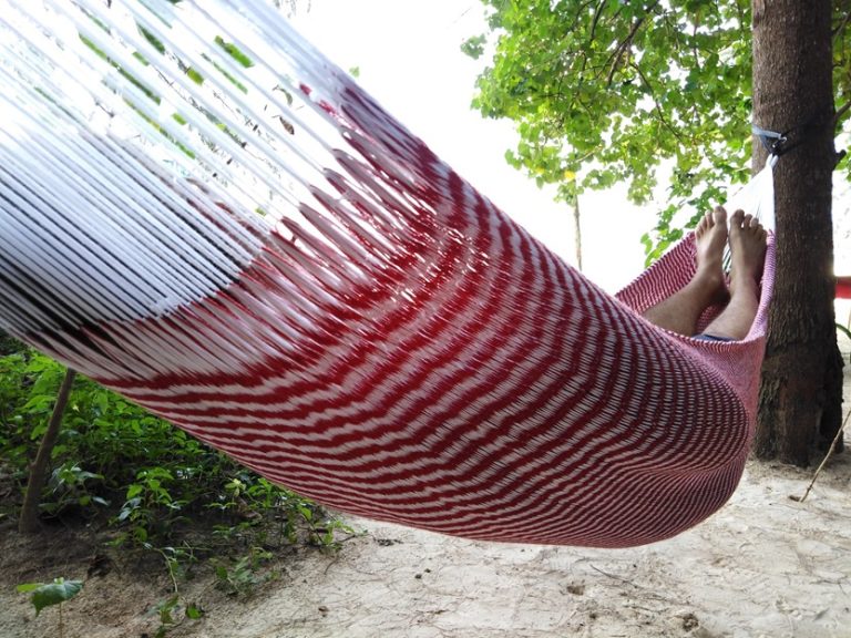 a person enjoy beach time in ULA hammock