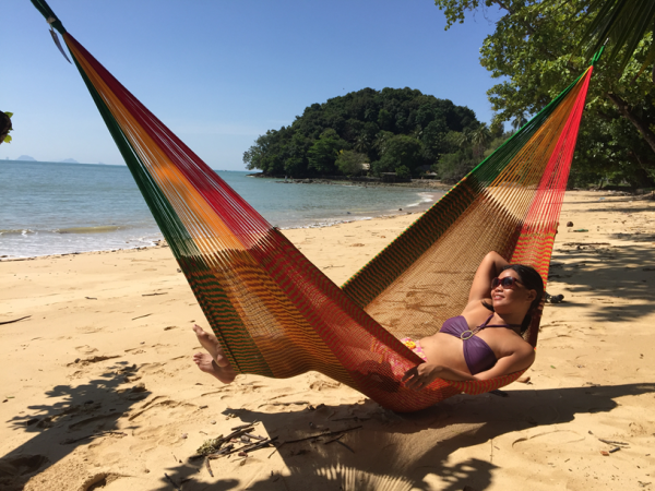 a girl in bikini in a hammock